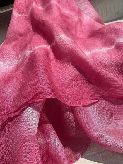 I call this one 'Flamingo'. It's a beautiful Kota silk stole dyed with Sappanwood to achieve this lovely shade of pink. The tie-dye pattern adds a touch of modern artistry to the traditional fabric.