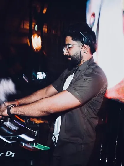 A motion blur shot capturing the fast-paced energy of a live set. This image reflects the dynamic and constantly moving environment of a club night.