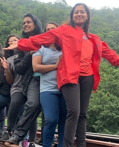 The joy of reaching a destination together. Our group rides are about the journey and the shared experience, like this fun moment on the railway tracks in Sakleshpura.