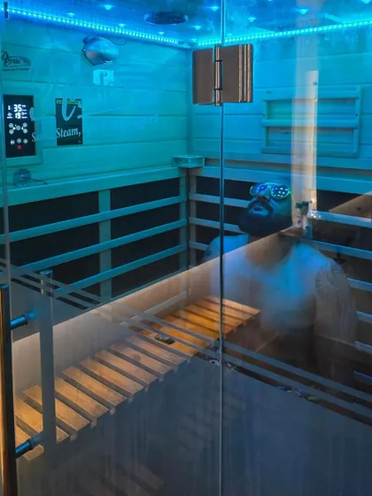 This shot shows the full interior of our infrared sauna cabin, viewed from the outside. The modern design and clean lines reflect my commitment to providing a high-quality, professional wellness experience.