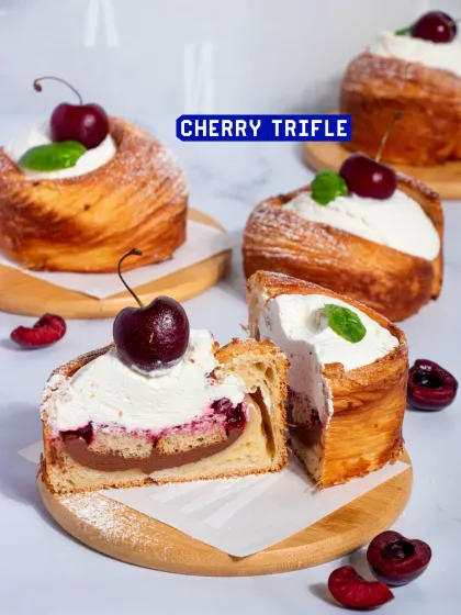 My Cherry Trifle is another showstopper dessert. It features layers of croissant dough, vanilla sponge, dark chocolate ganache, and cherry compote, all topped with fresh cherries.