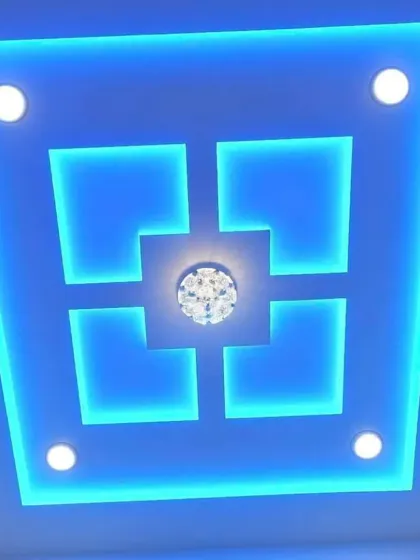 Don't be afraid of color. This bold, geometric design uses vibrant blue backlighting to create a futuristic and energetic mood, perfect for a modern bedroom or entertainment area. The design features sharp lines and spotlights for a clean finish.