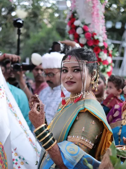 A candid moment during the Antarpat ritual. The bride's makeup is perfect for this important part of the ceremony.