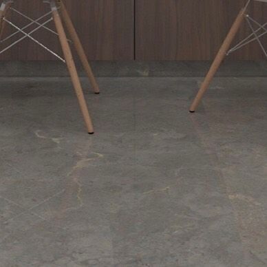 A detail shot of a natural stone floor, likely Kota stone, selected for its durability and timeless appeal. The subtle variations in the stone's texture and color add character to the interior space.