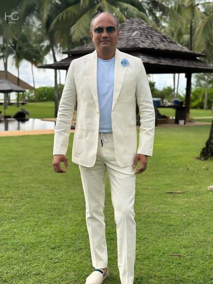 My client looking effortlessly stylish in a custom-made off-white linen suit. It's the perfect choice for a destination event or a smart summer gathering, blending comfort and elegance.