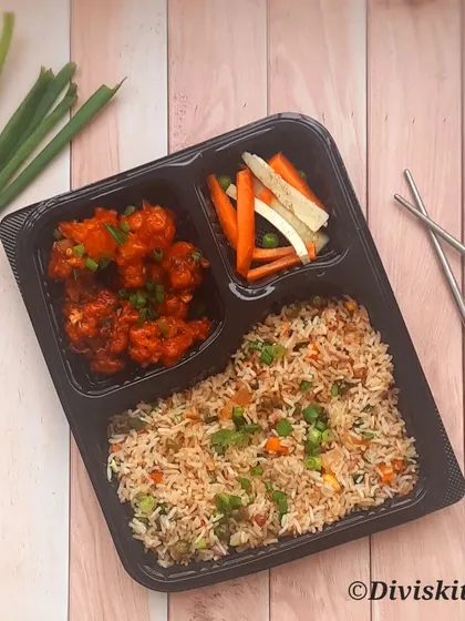 Beyond party boxes, I also prepare complete meal combos. This Chinese meal features my vegetable fried rice, gobi manchurian, and a side of pickled vegetables, all packed and ready to enjoy.