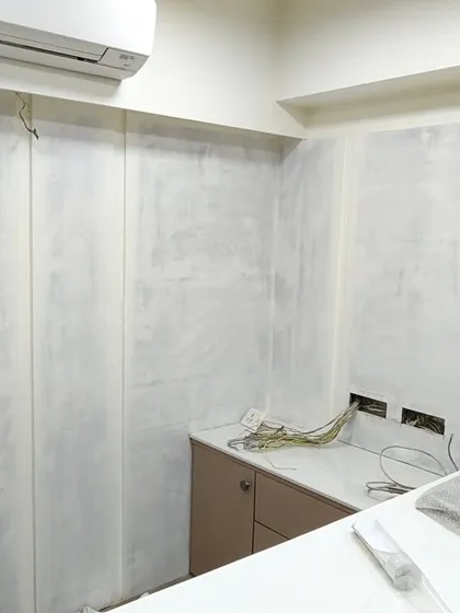 Here, I installed simple textured wallpaper panels in an office. This adds a touch of elegance and texture to the walls without being distracting.