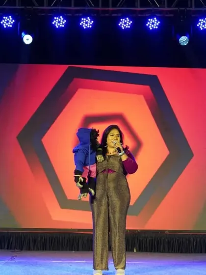 On stage with Nikki, doing what I love most. The vibrant stage lights and a captive audience are all we need to create a magical and hilarious experience.