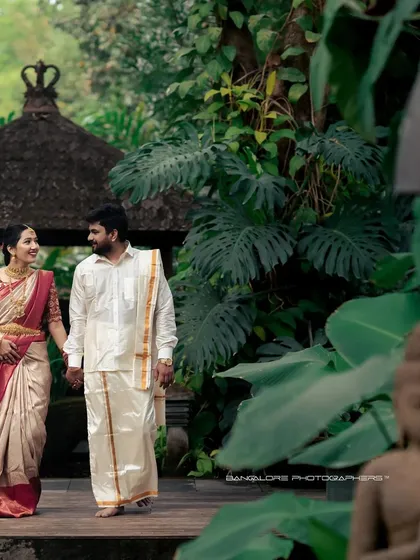 In the serene setting of a lush garden, this couple shares a quiet moment in their beautiful traditional attire. This post-wedding portrait shows how I capture cultural elegance and gentle affection, creating a timeless image that feels both regal and deeply personal.