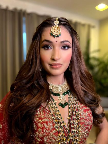 A close-up on the soft and glamorous makeup. The winged eyeliner and nude lip are a classic combination that never goes out of style.