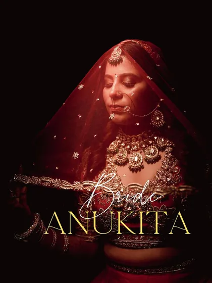 A bride's portrait should be a work of art. Using dramatic lighting and a sheer red veil, we created this artistic shot that highlights the bride's regal jewelry and serene expression, turning a moment of quiet reflection into a powerful image.