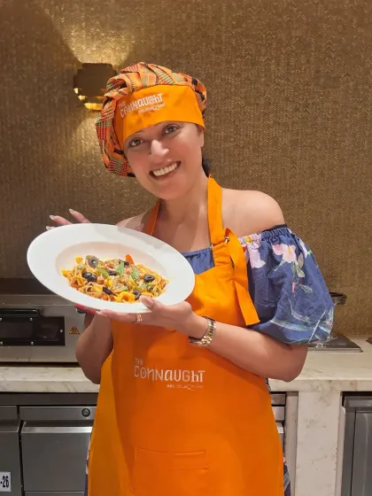 Having fun at a pasta-making session at The Connaught. I love participating in unique hotel experiences and sharing them with my audience.