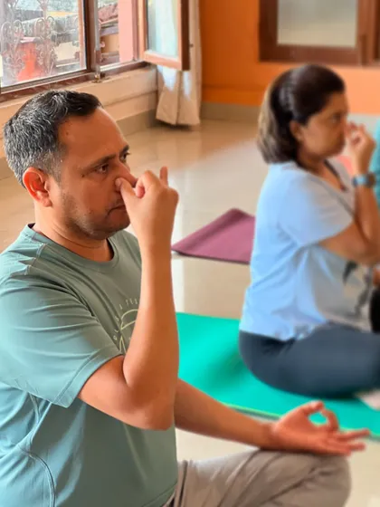 A student focuses on his breath during a pranayama session. For men, these practices are great for boosting energy, improving sleep, and increasing mental sharpness.