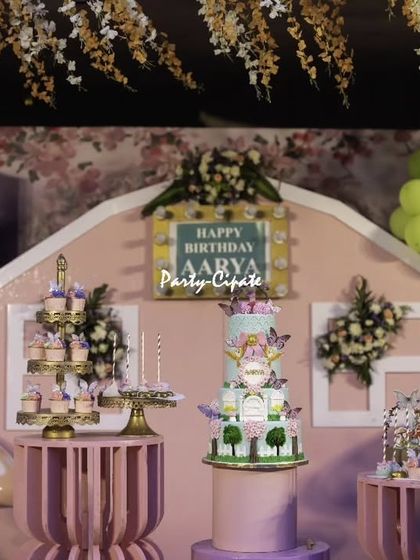 The main stage featured a custom-built fairy house backdrop, complete with a birthday sign and a beautiful display for the cake and desserts.