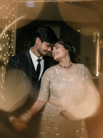 It's in these unscripted, in-between moments that the truest emotions shine. We focus on capturing the genuine connection and quiet intimacy, where a simple touch and a shared smile speak volumes, framed by the soft glow of celebration.