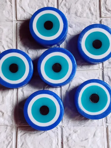 Another view of the striking blue and white evil eye soaps.