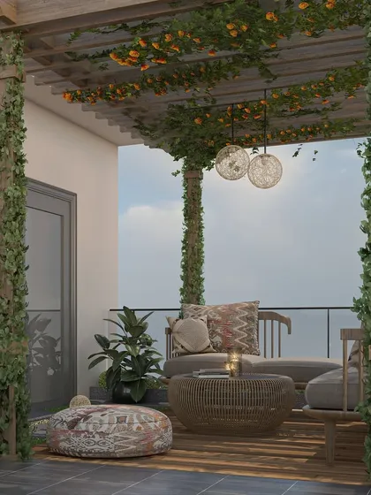 This close-up shot focuses on the cozy seating arrangement under the vine-covered pergola. The combination of a wooden loveseat, a woven coffee table, and bohemian-style cushions creates a relaxed and inviting atmosphere.