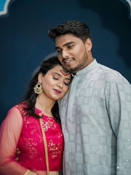 A vibrant party makeup look for a pre-wedding event. The pink outfit is complemented by a soft pink eyeshadow and a bold lip.