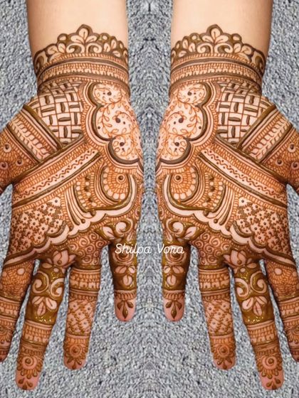 A symmetrical design with a mix of geometric and floral patterns, showing great attention to detail.