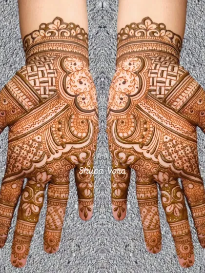 A symmetrical design with a mix of geometric and floral patterns, showing great attention to detail.