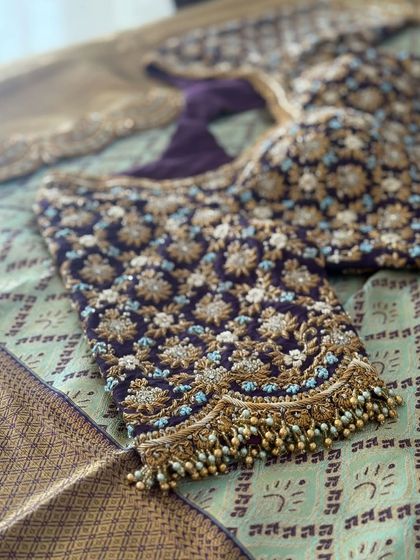Another angle of the purple velvet zardosi blouse, showing the texture of the embroidery.