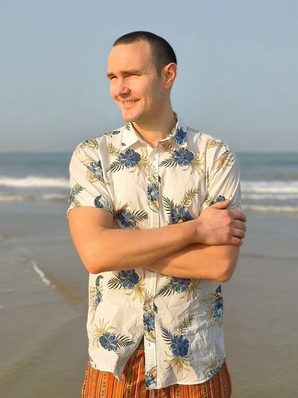 A relaxed portrait of a man on the beach, with a genuine smile. This shot shows my ability to make subjects feel comfortable and capture their natural personality.