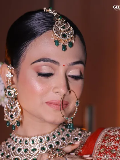 Student Work: A close-up of a bridal look focusing on soft, shimmering eyeshadow and perfectly blended skin. The subtle glow on the cheeks adds a touch of radiance.