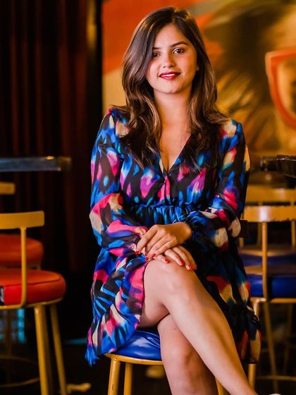 A guest looking elegant in a multi-colored dress.