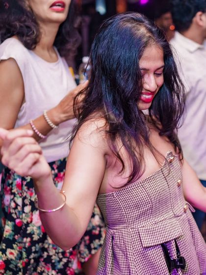 Friends dancing together and having a great time.