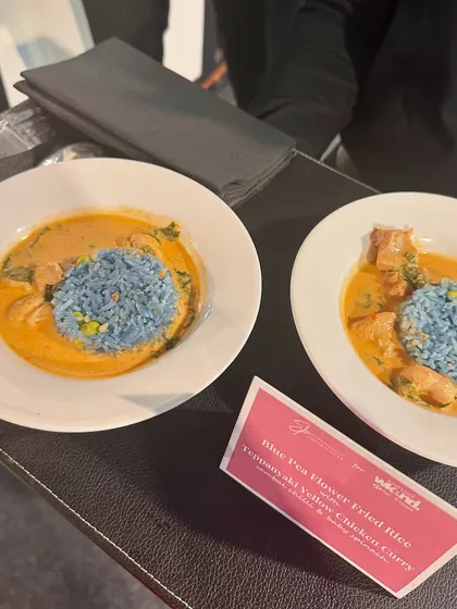 Blue Pea Flower Fried Rice paired with a Teppanyaki Yellow Chicken Curry, a vibrant and flavourful main course option.
