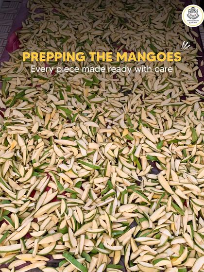 Prepping the mangoes is a crucial step. Every piece is made ready with care, sliced to the right size to soak up all the delicious masalas.