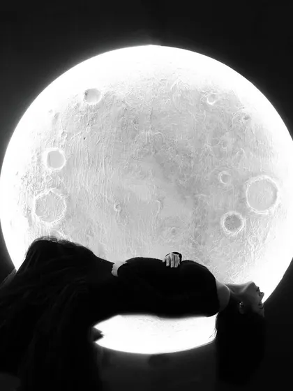 For a touch of celestial magic, we created this unique moon backdrop. This artistic black and white silhouette shot is a powerful and creative way to portray the wonder of pregnancy, making for a truly unforgettable image.