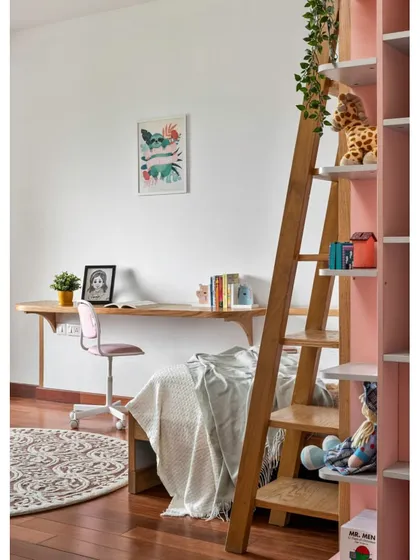 The bunk bed in 'Vasudhalayah' is paired with a sleek, wall-mounted study desk, maximizing floor space for play.