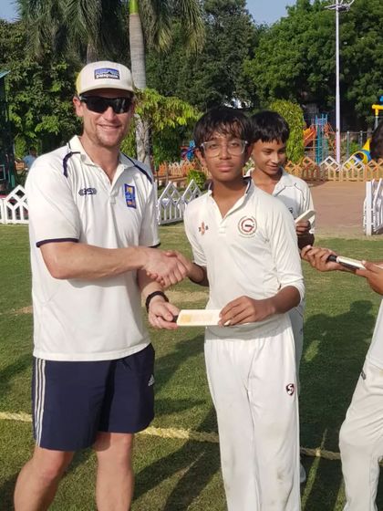 A handshake between my young student and an international player. Moments like these inspire them to dream big.