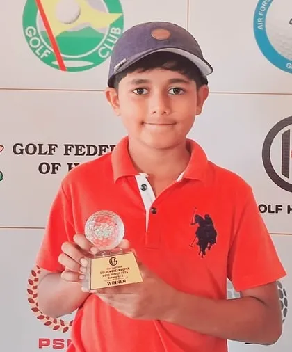 A close-up of Taanush Kumar with his trophy from the Haryana Junior Tour.
