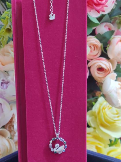A stunning multi-colored crystal swan pendant, inspired by Swarovski designs, perfect for adding a touch of vibrant elegance.