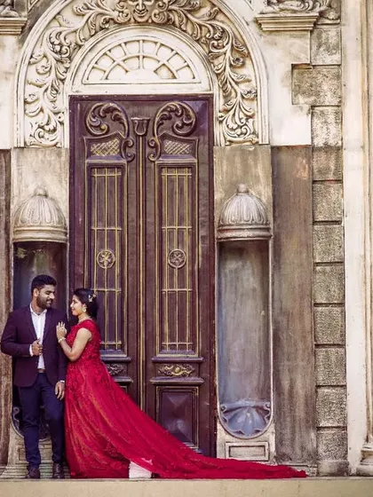 This is the kind of epic pre-wedding shot we can create. The couple is using one of our grand outdoor sets, with the bride-to-be in a flowing red rental gown that adds a perfect pop of color.