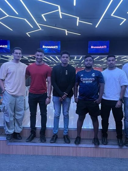 Another group of finalists posing for a photo before the big bowling league final. The competition is always fierce but friendly.