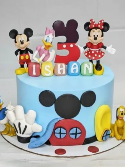 Come inside, it's fun inside! This Mickey Mouse Clubhouse cake brings the whole gang together. It's a fresh and delicious homemade eggless cake, perfect for a Disney-loving toddler.
