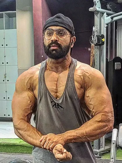 This was me four weeks out from the Sheru Classic. You can see the vascularity and conditioning coming through. My contest prep diet and peak week strategy are designed to get you this dry, shredded look under the stage lights.