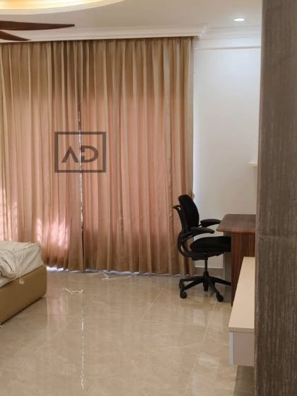 In this bedroom, the goal was to create a restful environment. I installed these floor-to-ceiling blackout curtains that block morning sun and provide complete privacy, complementing the room's calm and modern aesthetic.