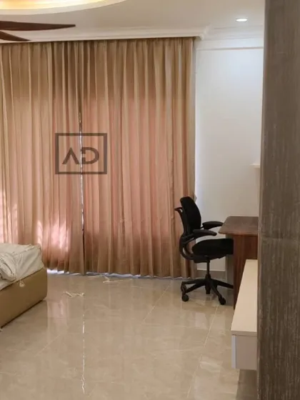 In this bedroom, the goal was to create a restful environment. I installed these floor-to-ceiling blackout curtains that block morning sun and provide complete privacy, complementing the room's calm and modern aesthetic.