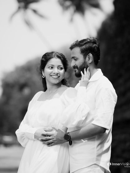A beautiful black and white portrait capturing a loving gaze between the couple. The simplicity of monochrome photography puts all the focus on their emotional connection.