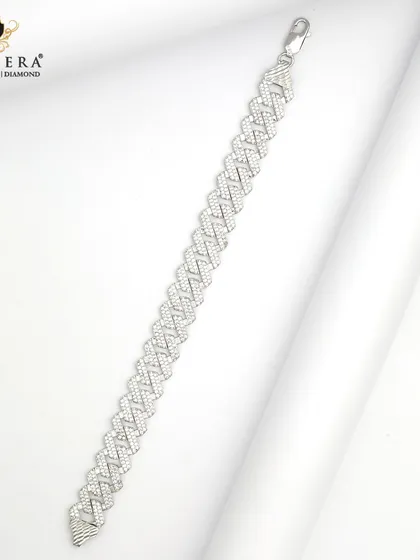 A substantial men's silver bracelet with a modern, woven-style link. This piece is designed for elegance and durability.