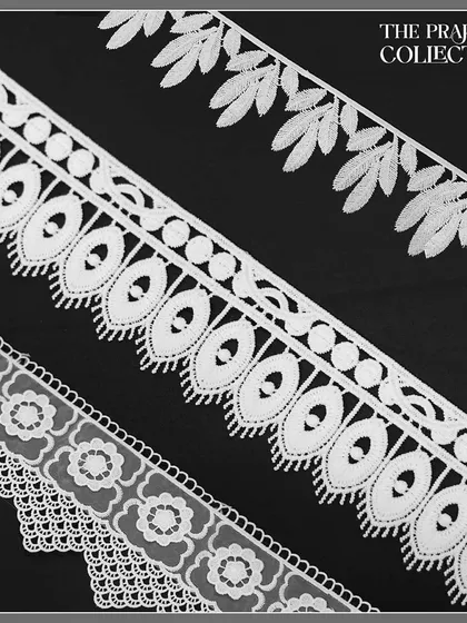 A display of classic white crochet laces in various patterns, from delicate florals to geometric designs. These timeless trims are versatile for adding an elegant touch to dresses, blouses, and home furnishing projects.