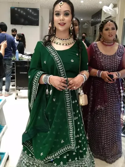 The complete look. This full-length view shows how the makeup, hair, and outfit all come together for a stunning final result for a wedding guest.