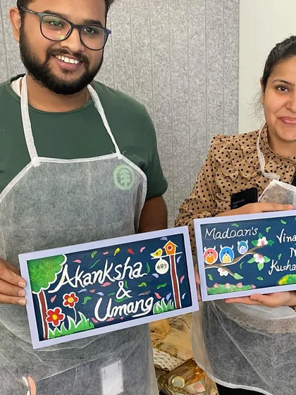 It’s amazing what you can create in a short time! These participants from a corporate paint party are proudly holding up the custom nameplates they designed for their homes and desks.