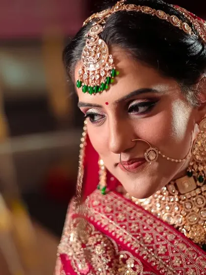 A candid portrait of the bride, her shy smile and downward glance capturing the emotions of her wedding day in Jim Corbett.