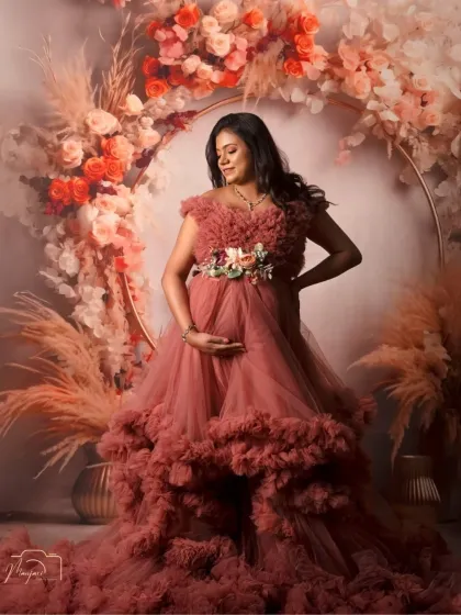 The way she cradles her bump shows the deep love and connection she already feels. A beautiful solo portrait celebrating motherhood.
