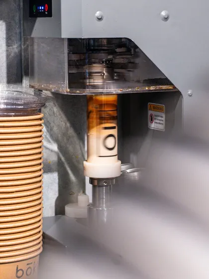 A unique coffee packaging concept from Bokka Coffee, where the cup is sealed in a can. This shot highlights the innovative branding of the cafe.